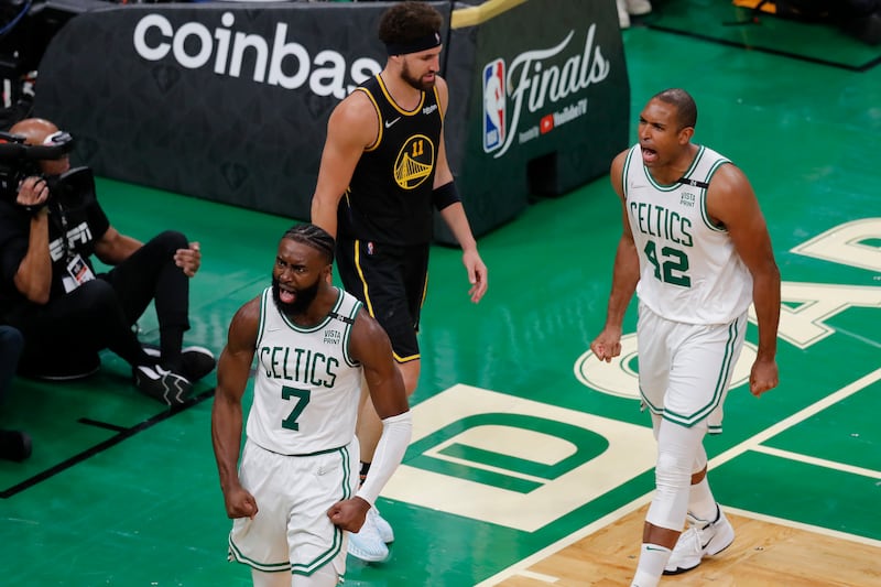 Boston Celtics guard Jaylen Brown (7) and center Al Horford (42) yell