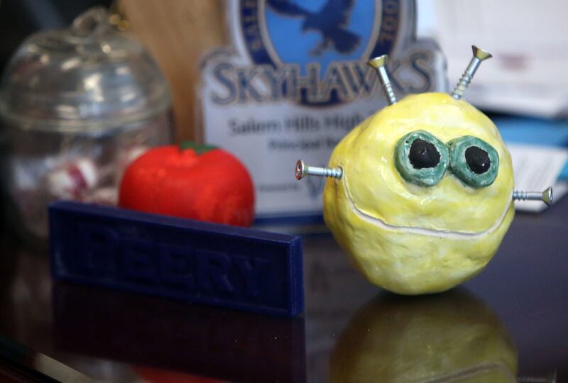 At Salem Hills High School in Salem on Thursday, May 24, 2018, Principal Bart Peery keeps a ceramics piece on his desk that was given to him by a student who committed suicide.