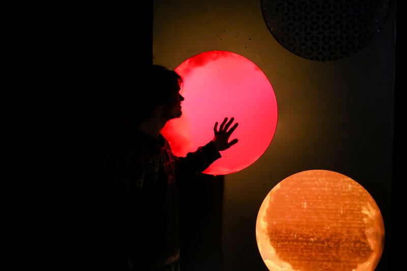 Jordan Hess, 23, walks through Dreamscapes, an interactive art space at the Rio Grande in Salt Lake City on Friday, March 15, 2019.