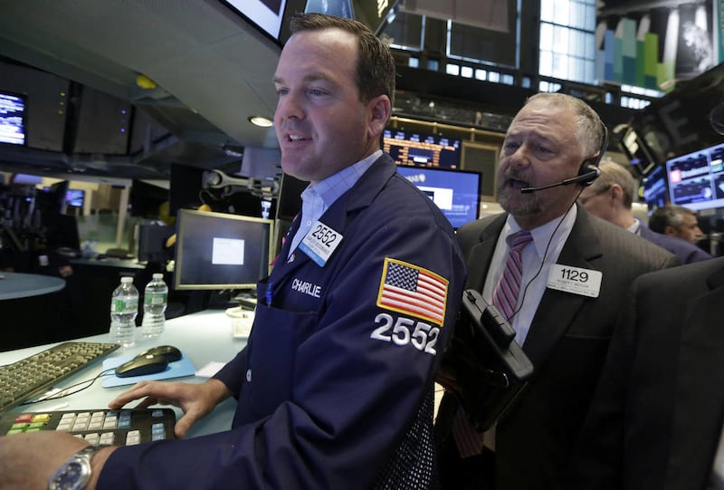 Specialist Charles Boedinghaus, left, and trader Robert Moran, work at a post on the floor of the New York Stock Exchange, during the IPO of Parsley Energy, Friday, May 23, 2014. Founded in 2008, Parsley Energy is an independent oil and natural gas compan