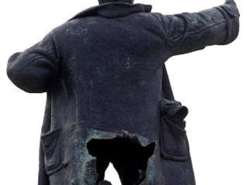 One of Russia's best-known statues of Vladimir Lenin is seen after being damaged by a blast in St. Petersburg, Russia, Wednesday. The blast hit the towering statue Tuesday night in the square outside Finland Station.
