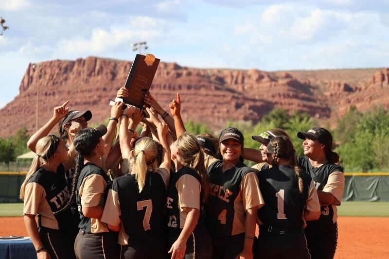 The Temple Leopards hoist the national championship trophy in the air at the Canyons Softball Complex in St. George after winning the 2018 NJCAA Division I National Softball Championship on Saturday afternoon.
