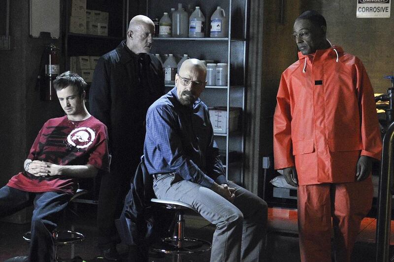 (L-R) Jesse Pinkman (Aaron Paul), Mike (Jonathan Banks), Walter White (Bryan Cranston) and Gustavo Fring (Giancarlo Esposito) in Breaking Bad. A popular TV series on AMC, Breaking Bad follows the life of a high school teacher who is diagnosed with termina