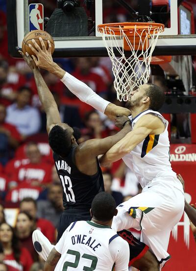 Utah Jazz center Rudy Gobert (27) blocks a shot by Houston Rockets guard James Harden (13) as the Utah Jazz and the Houston Rockets play game two of the NBA playoffs at the Toyota Center in Houston on Wednesday, May 2, 2018.