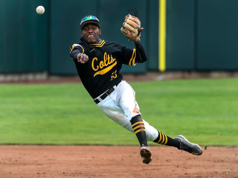 Cottonwood shortstop Daniel Gonzalez fires to first for an out as Cottonwood defeats Timpanogos for the 5A high school baseball championship at the UCUU ballpark in Orem on Friday, May 24, 2019.