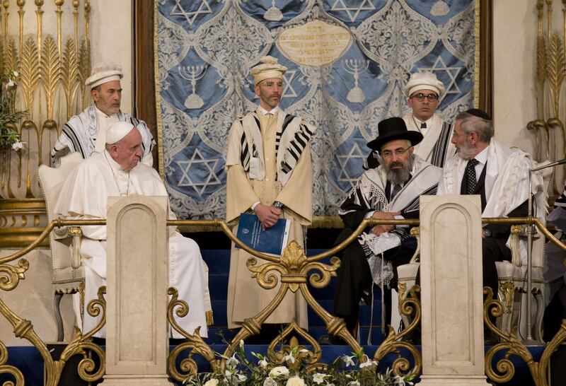 Pope Francis sits flanked by Rabbi Riccardo Di Segni, right, during his visit to the Great Synagogue of Rome, Sunday, Jan. 17, 2016. Pope Francis made his first visit to a synagogue as pope Sunday, greeting Rome's Jewish community in their house of worshi