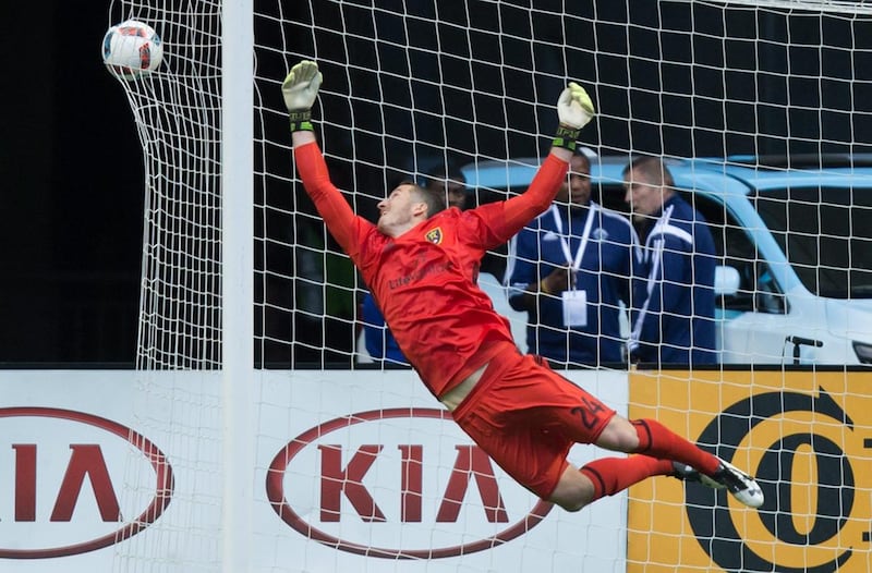 Real Salt Lake goalkeeper Jeff Attinella allows a goal to Vancouver Whitecaps' Cristian Techera during the first half of an MLS soccer match Wednesday, July 13, 2016, in Vancouver, British Columbia. (Darryl Dyck/The Canadian Press via AP)