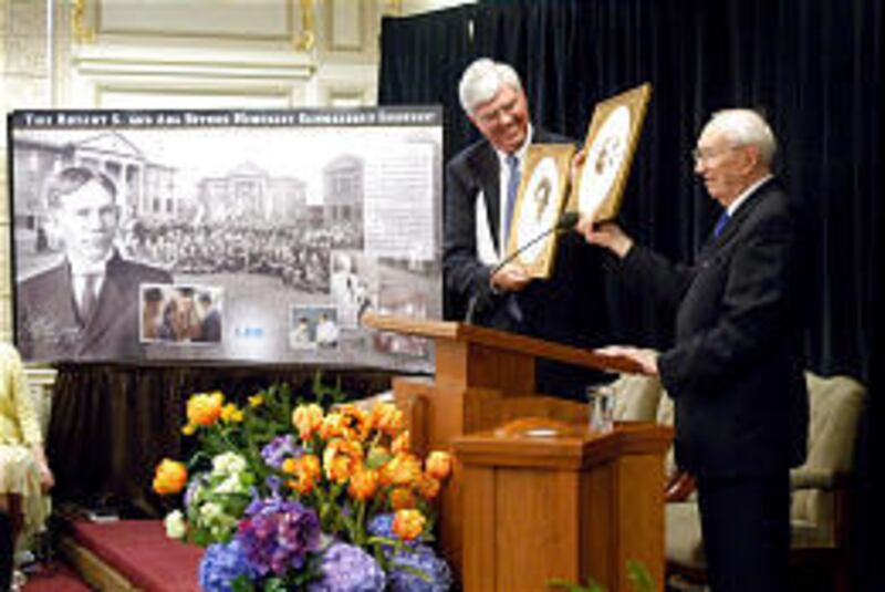 LDS President Gordon B. Hinckley, right, and Stephen K. Woodhouse laud a scholarship fund at LDS Business College honoring Hinckley parents.