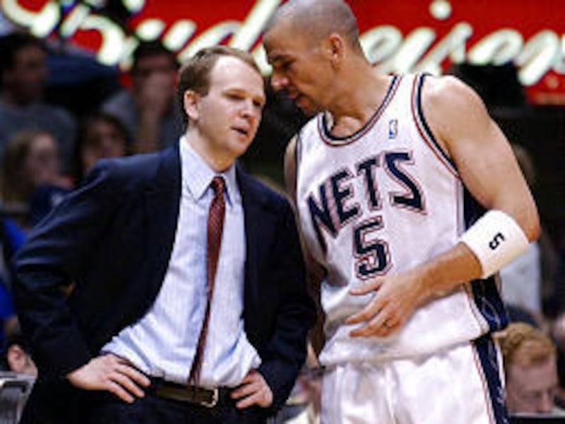 New Jersey Nets coach Lawrence Frank talks to point guard Jason Kidd during Saturday's win over Hornets.