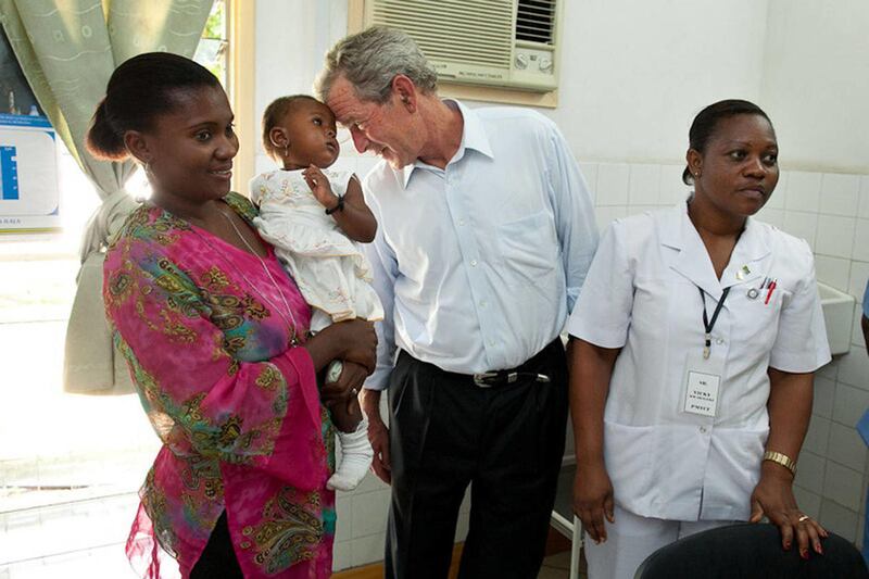 President Bush visits PEPFAR supported AIDS Clinic in Dar es Salaam, Tanzania on World Aids Day. One million HIV-free babies have now been born to HIV-positive mothers, and 13 countries are at an AIDS "tipping point": more people are newly receiving treat