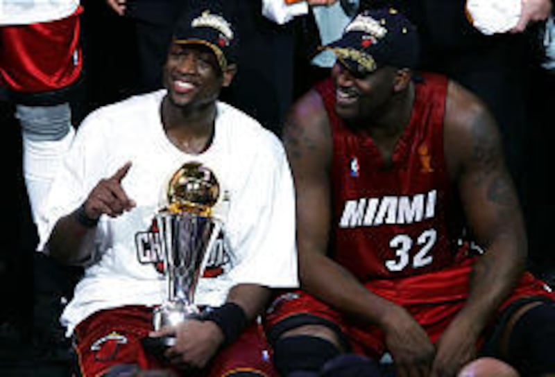 Dwyane Wade and Shaquille O'Neal (32) celebrate after the Heat won the 2006 NBA finals on Tuesday night in Dallas.