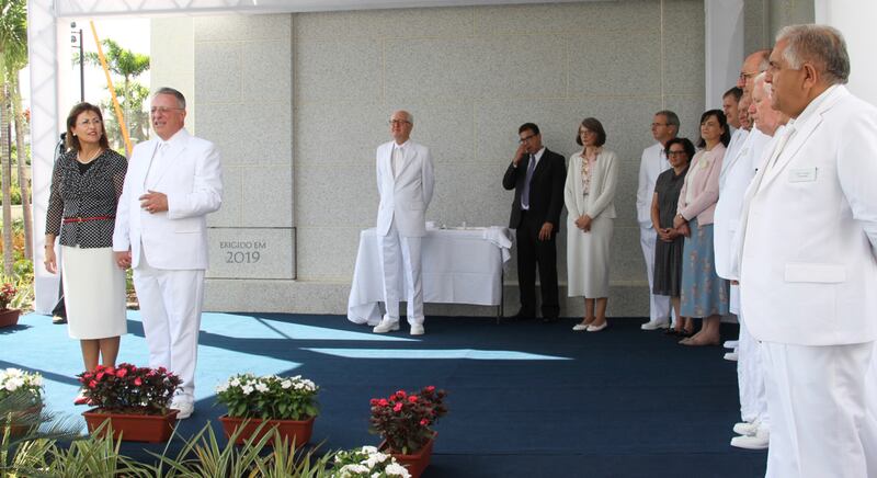 Elder Ulisses Soares of the Quorum of the Twelve Apostles, at left with his wife, Sister Rosasa Soares, speak to members gathered at the cornerstone ceremony of the Fortaleza Brazil Temple on Sunday, June 2, 2019. They are joined by other visiting general