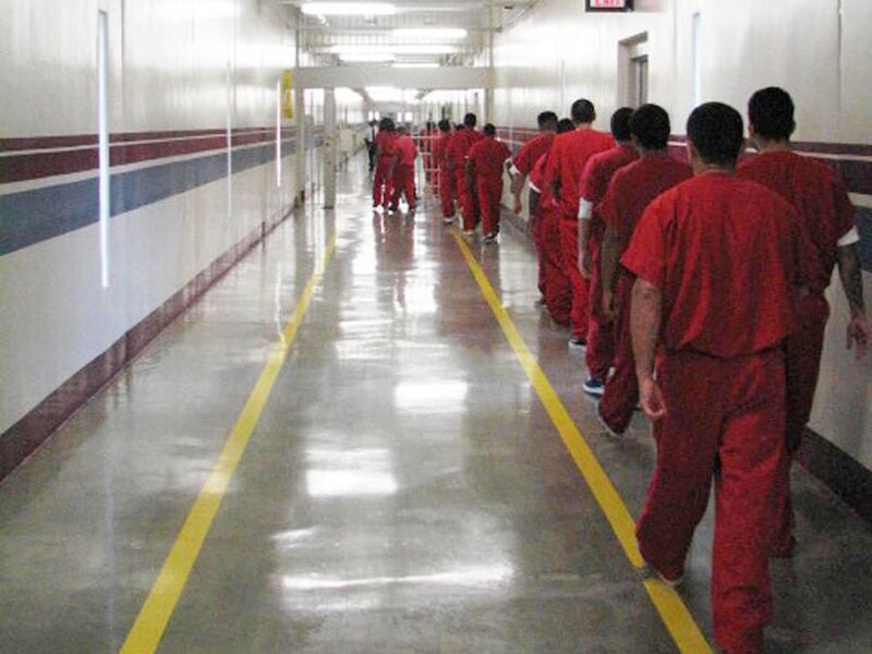 In this undated photo, immigrants walk to hearings at the Stewart Detention Center in Lupmkin, Ga. Gillian Christensen, an ICE spokeswoman, said ICE has reviewed "several hundred cases" of immigrants being held in jails around the country and released the