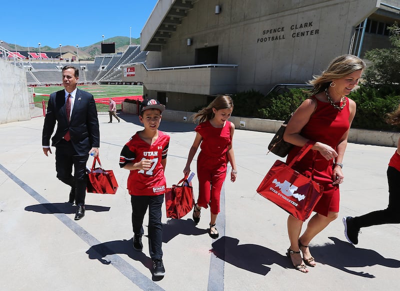 University of Utah’s new Athletics Director Mark Harlan, his wife Carolyn, and kids Savannah and Austin leave the field at Rice Eccles Stadium on Monday, June 4, 2018.