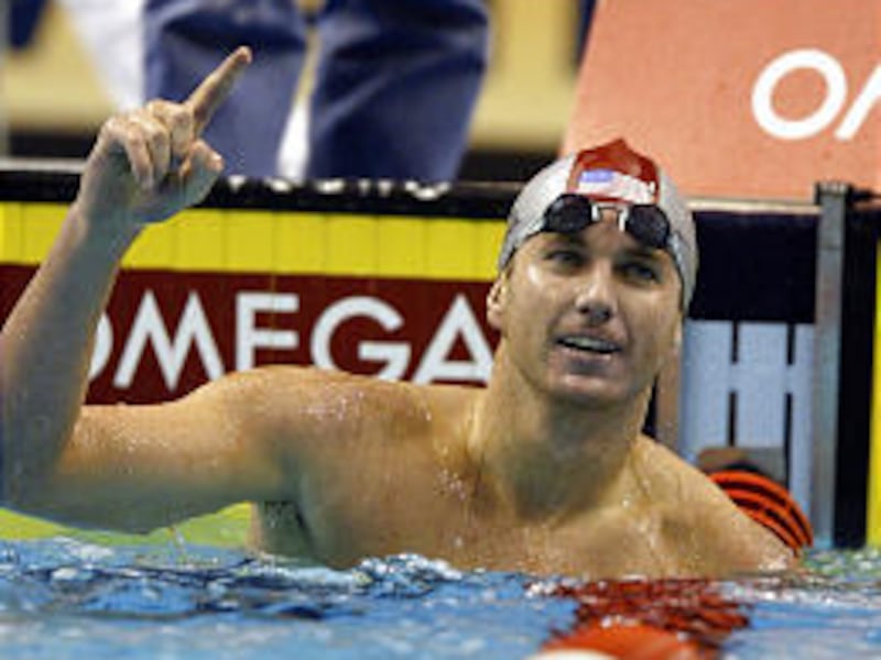 Aaron Peirsol of the United States celebrates after winning the gold medal and setting a new world record in the finals of the men's 200-meter backstroke Monday at the Short Course World Championships.