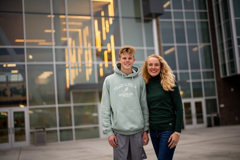 Rebecca Martin, president of the Hillcrest High School PTSA, and her son, Joshua Martin, 16, pose for a photo at the school in Midvale on Nov. 7, 2023.