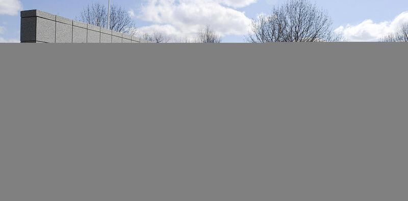 FILE - This May 4, 2011 file photo shows the entrance to the Sears Holdings Corp. Prairie Stone campus area in Hoffman Estates, Ill. Sears Holding Corp. spokesman Chris Brathwaite told Crain's Chicago Business the company is laying off "about 100 people"