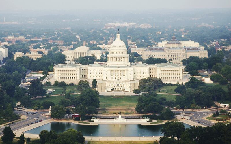 An aerial photo of the U.S. Capitol and surrounding buildings.