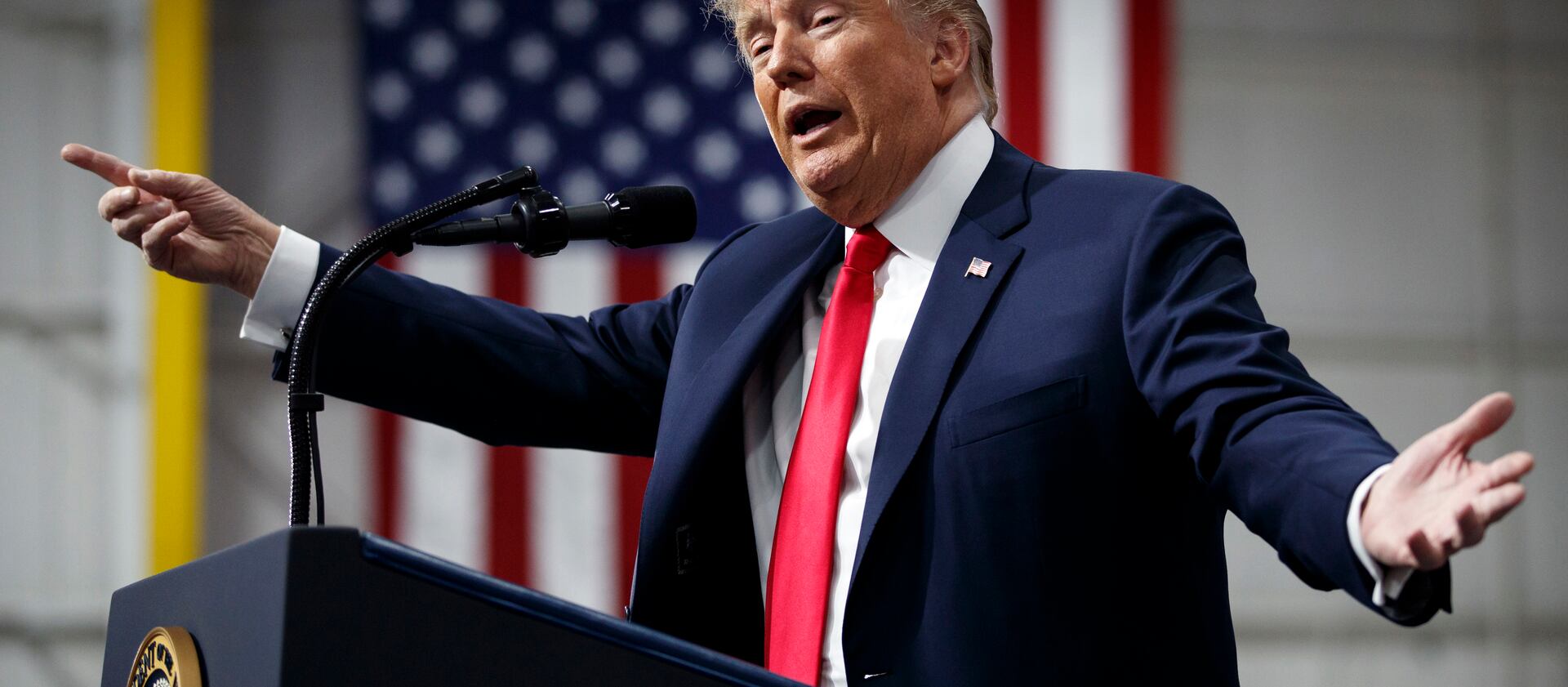 In this March 10, 2018, photo, President Donald Trump speaks at a campaign rally at Atlantic Aviation in Moon Township, Pa. Weeks after prodding lawmakers to stand up to the National Rifle Association,Trump is backing off his call for increasing the minim
