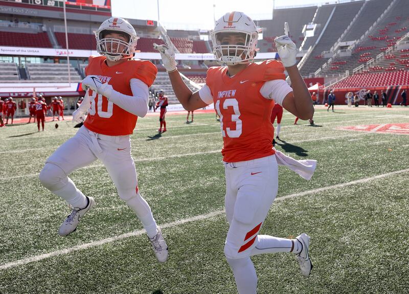 Timpview celebrates winning a 5A football state semifinal game against Olympus at Rice-Eccles Stadium in Salt Lake City.