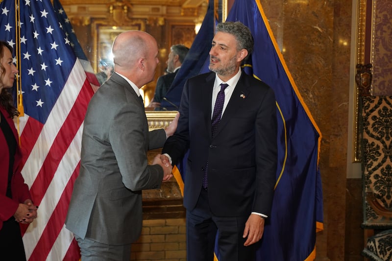Gov. Spencer Cox, left, greets Israel Bachar, Consul General of Israel, at the State Capitol on Dec. 5, 2023.