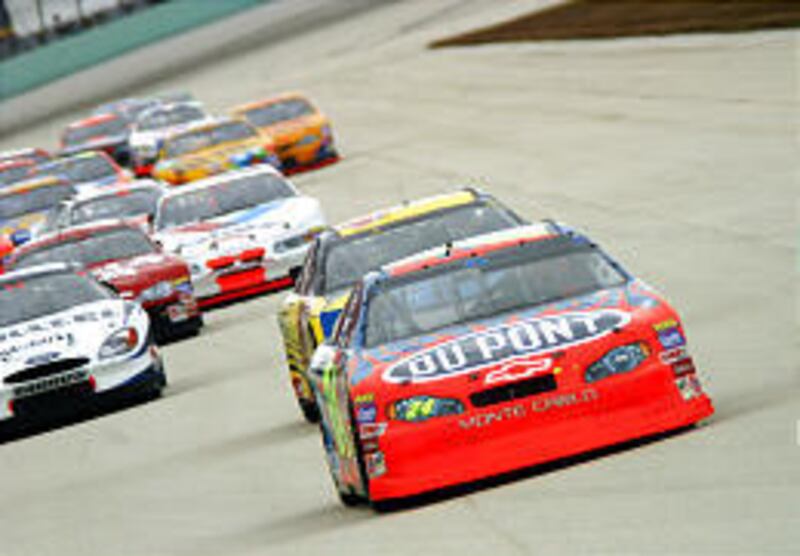 Drivers fight for position as they try to be first to get checkered flag in "NASCAR 3D: The IMAX Experience."