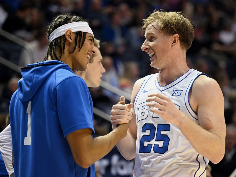 Brigham Young Cougars guard Trey Stewart congratulates Brigham Young Cougars guard Dawson Baker