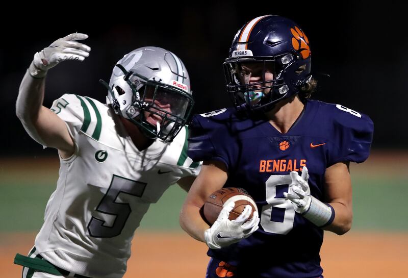 Olympus’ Jackson Godfrey, left, moves in for the tackle on Brighton’s Nash Matheson during a game on Friday, Sept. 10, 2021.