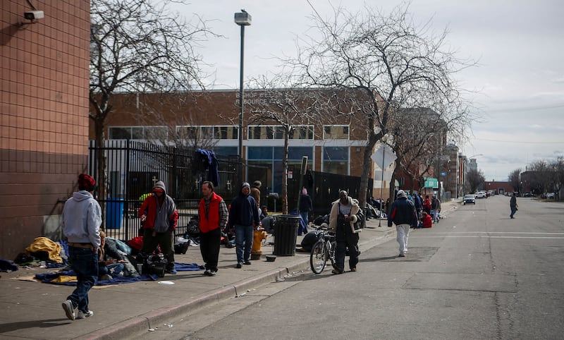 Homeless people in Salt Lake City wait outside Catholic Community Services at 200 S. 500 West next to the Road Home, called "the block," on Wednesday, March 8, 2017.