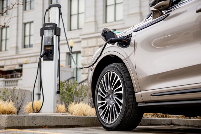 An electric vehicle charges at a charging station at the Capitol in Salt Lake City.