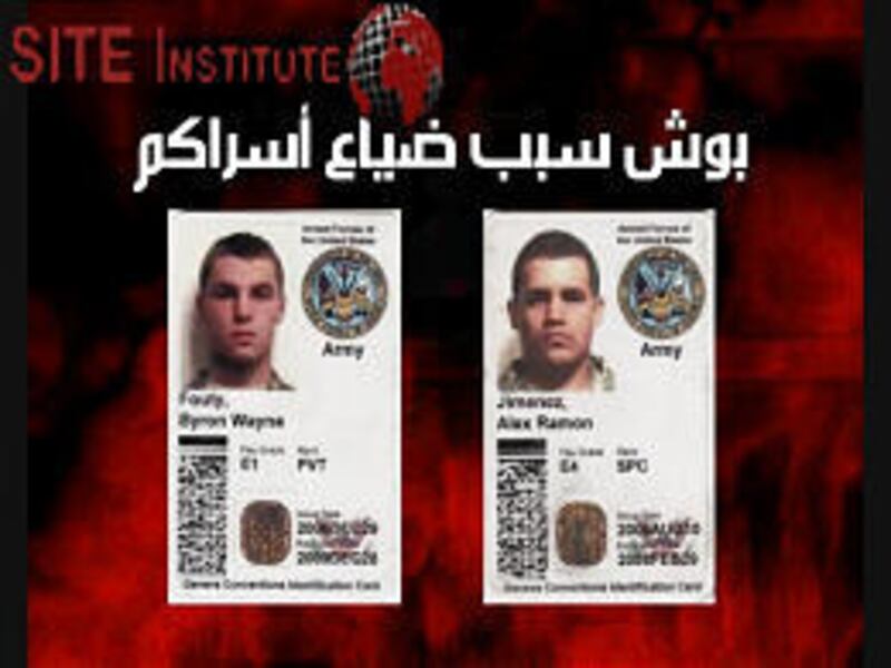 An image taken from militants' video shows ID cards of Pvt. Byron Fouty, 19, and Spc. Alex Jimenez, 25, which were called "booty."
