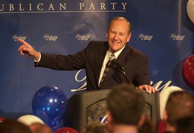 Rep. Jim Hansen, R-Utah, smiles while watching the presidential numbers during Republican election night party at the Hilton Hotel in Salt Lake City on Nov. 7, 2000.