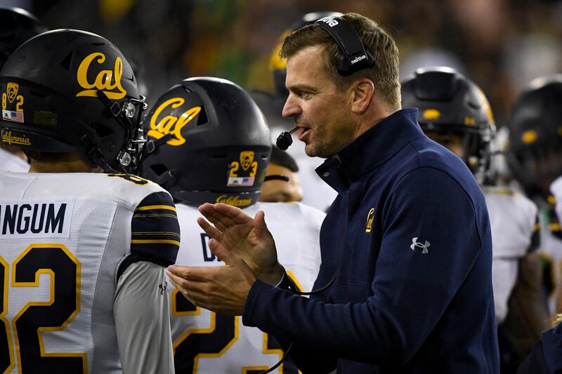 California head coach Justin Wilcox encourages his players during game Friday, Oct. 15, 2021, at Oregon.