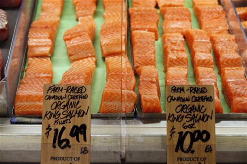 FILE — Canadian certified organic farm-raised King Salmon filets are for sale at the Wegmans, Friday, April 10, 2015 in Fairfax, Va. What's for dinner? Before long, it may well be genetically modified salmon, the first such altered animal cleared for huma