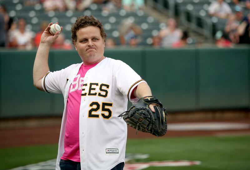 Patrick Renna, who played Ham in "The Sandlot," warms up before cast members throw the first pitch to celebrate the movie's 25th anniversary at Smith's Ballpark in Salt Lake City on Thursday, Aug. 9, 2018.