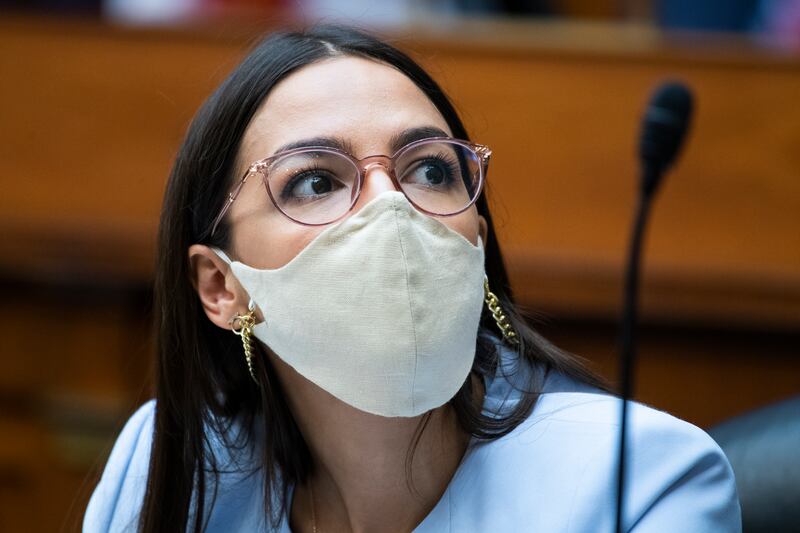 Rep. Alexandria Ocasio-Cortez, D-N.Y., listens during a House Oversight and Reform Committee hearing on the Postal Service on Capitol Hill, Monday, Aug. 24, 2020, in Washington.