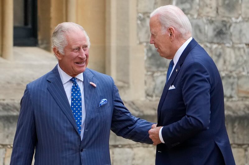 President Joe Biden speaks to Britain’s King Charles III at Windsor Castle in Windsor, England.