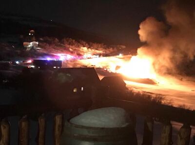 A fire burns following an explosion at a home in a gated community on Lake Pines Drive in Timber Lakes, which is just east of Heber City, on Friday, Feb, 15, 2019.