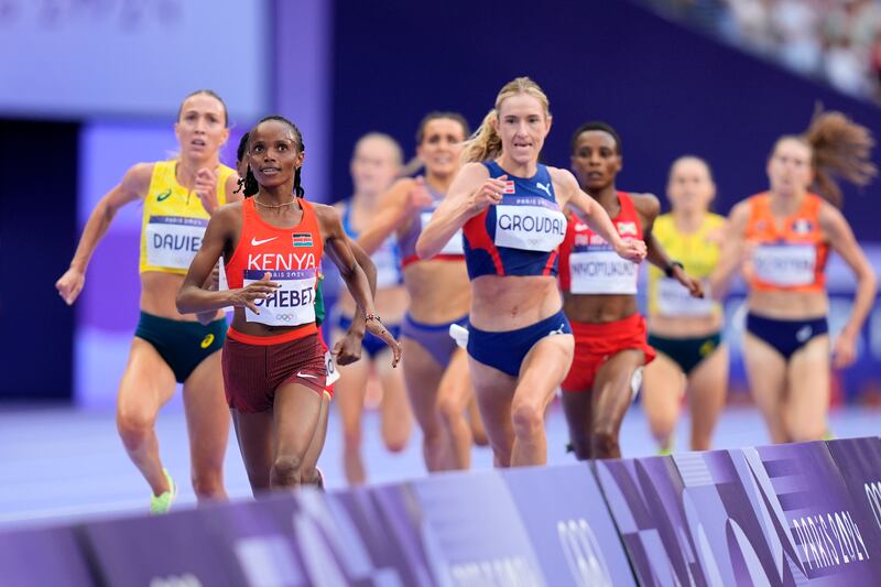 Beatrice Chebet, front, of Kenya, wins her women's 5,000-meter round 1 heat at the 2024 Summer Olympics, Friday, Aug. 2, 2024, in Saint-Denis, France. Former BYU star Whittni Morgan finished sixth to also advance to Monday's final.