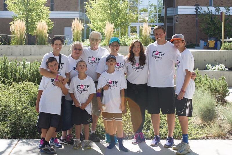 Sisters Becky Anderson and Brenda Smith stand with their families at the 4th annual F2TF 5K in honor of Tyler Smith, an Anything for a Friend recipient, whose mantra was "Fight to the Finish."