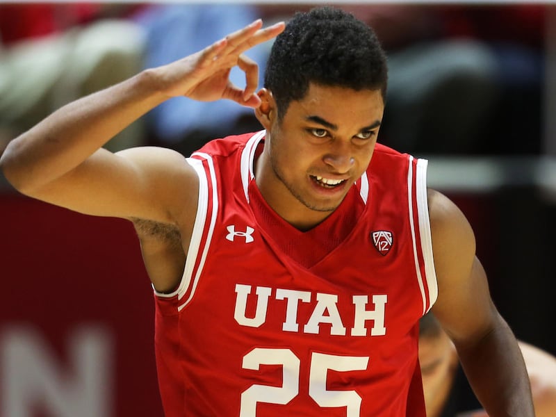 Utah Utes guard Kenneth Ogbe (25) celebrates a three point shot as Utah and BYU play in the Huntsman Center in Salt Lake City Wednesday, Dec. 2, 2015.