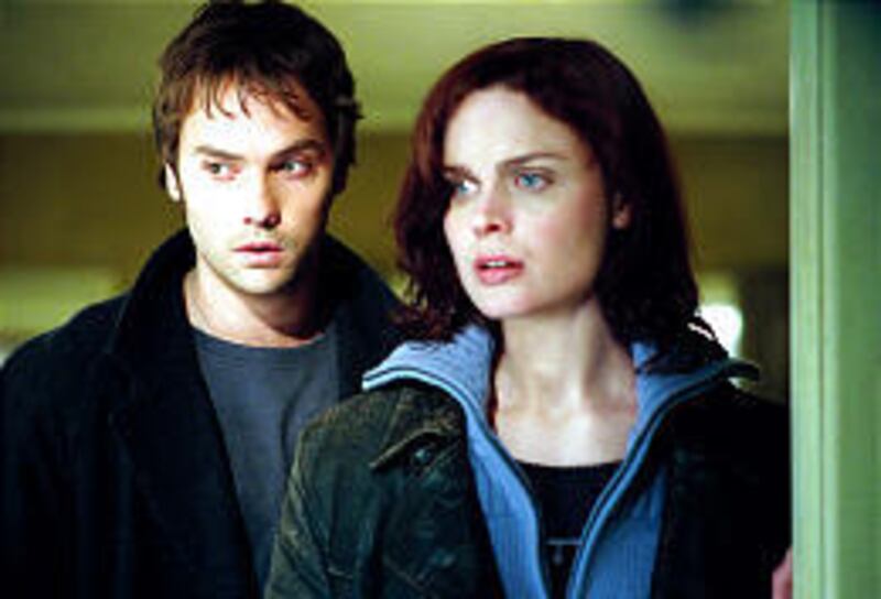 Tim, played by Barry Watson, and Kate, played by Emily Deschanel, spend a night in Tim's childhood home in "Boogeyman."