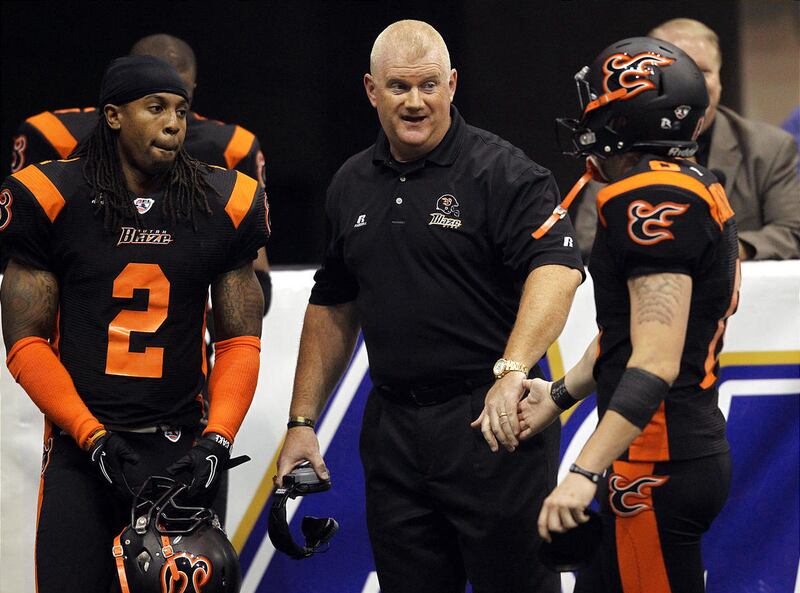 Utah Blaze Head Coach Ron James congratulates kicker Kyle Brotzman after a sucessful point after touchdown as the Blaze host the New Orleans Voodoo at Energy Solutions Arena in Salt Lake City on Saturday, July 16, 2011.