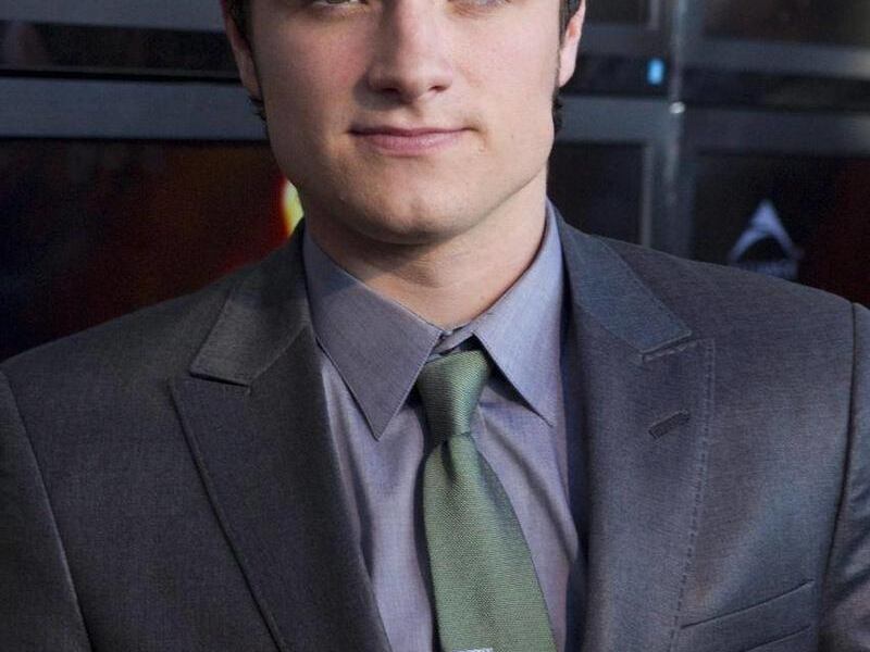 Josh Hutcherson, who portrays Peeta Mellark, poses on the red carpet for the premier the film "The Hunger Games" on Monday March 19, 2012 in Toronto.