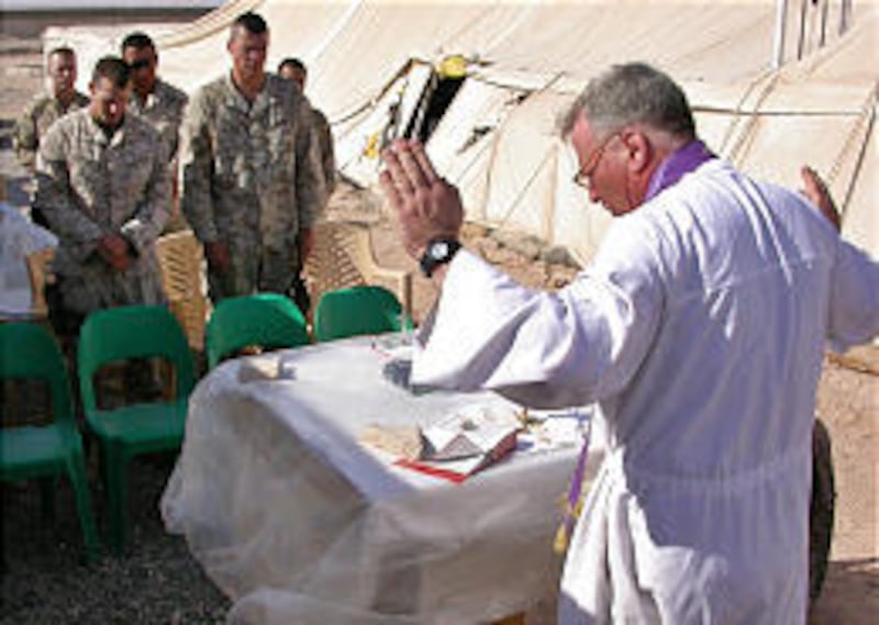 Marine Lt. Cmdr. Paul Shaughnessy, a Catholic chaplain, conducts Mass at a camp in Najaf, Iraq. Chaplains' prayers and comfort are hallowed tradition in the military.