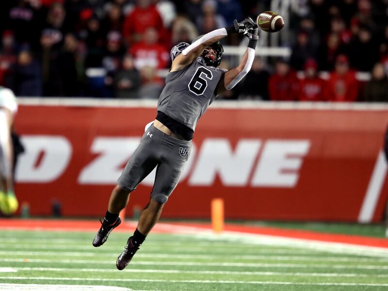 Utah safety Cole Bishop just misses an interception as Utah and Oregon play at Rice-Eccles Stadium in Salt Lake City.