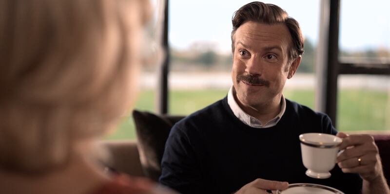 A film still of Ted Lass (Jason Sudeikis) holding a cup of tea on the Apple TV show, “Ted Lasso.”
