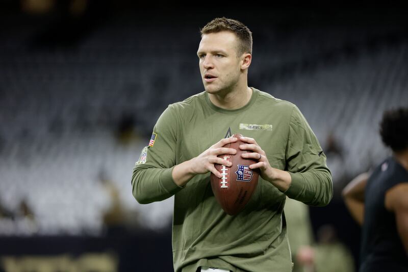 New Orleans Saints quarterback Taysom Hill (7) warms up before the first half of an NFL football game between the New Orleans Saints and the Atlanta Falcons.