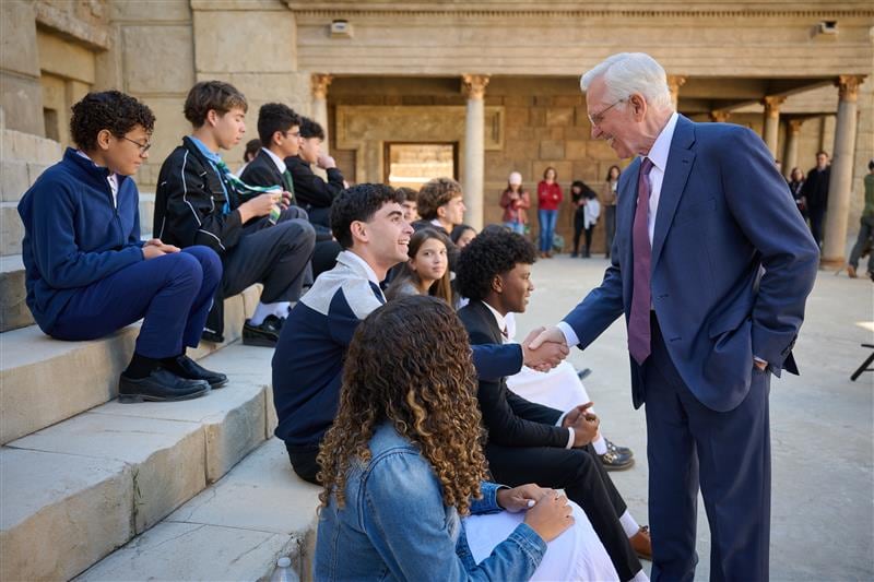 President D. Todd Christofferson, second counselor in the First Presidency, greets youth during the filming of the Jan. 18, 2026, worldwide discussion for youth on the Jerusalem set in Goshen, Utah.