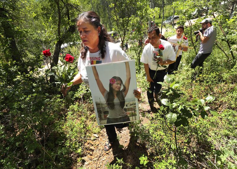 Libertad Edith Salgado Figueroa, mother of Elizabeth Elena Laguna Salgado, walks with family in Hobble Creek Canyon on Friday, June 15, 2018 where her daughters body was found.